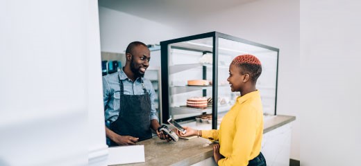 Woman paying at counter